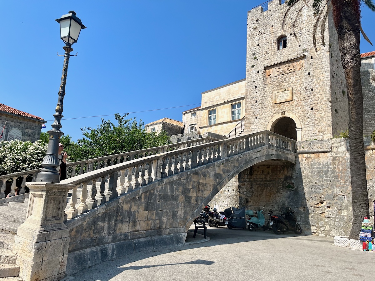 Mediterranean Cruise With Teens: Why Split & Korcula Wowed Us: The stone steps visitors climb at the entrance to Korcula's Old Town is part of its medieval seaside charm.
