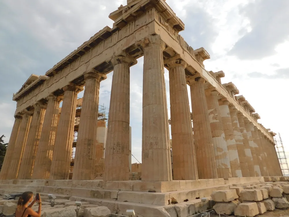 the parthenon on the acropolis in athens, at dusk.