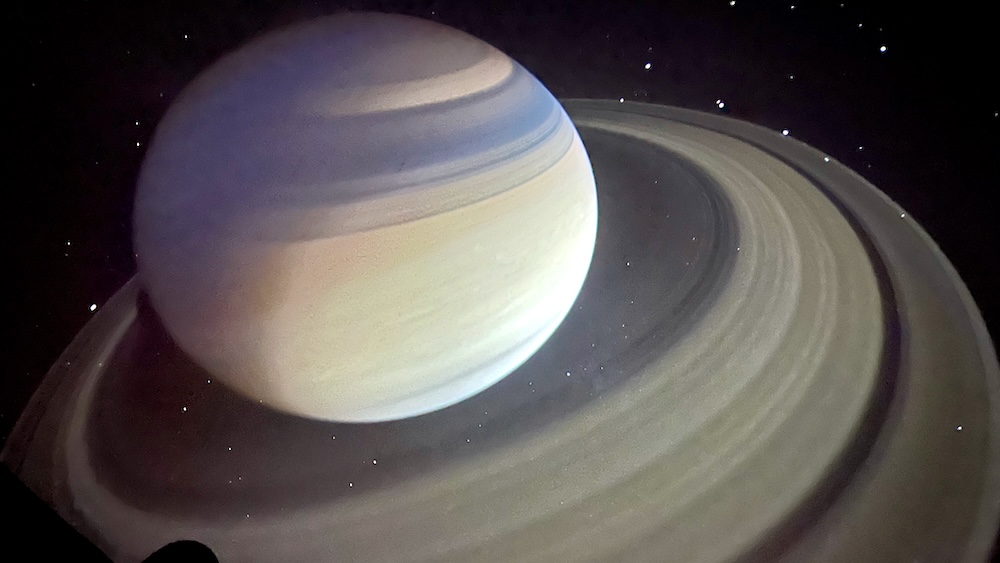 A view of saturn and its rings during the star show at rochester's planetarium.