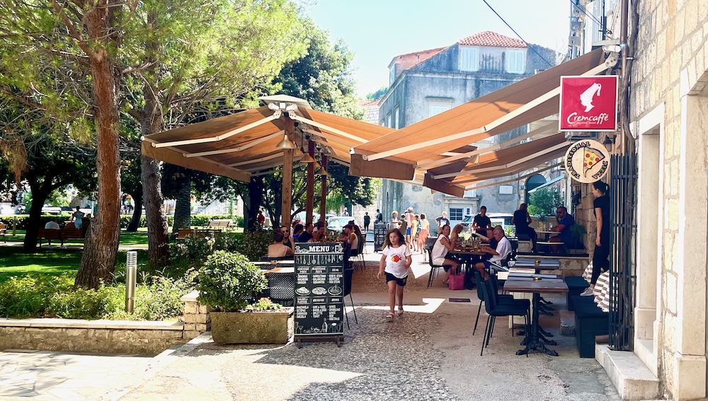 the shady welcoming patio of servantes food & wine bar outside of korcula's old town.
