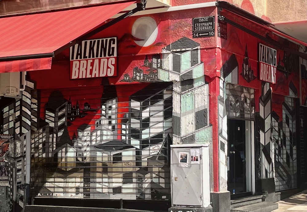 The red and black facade of talking breads in exarchia is reminiscent of a certain 80s band's album art.