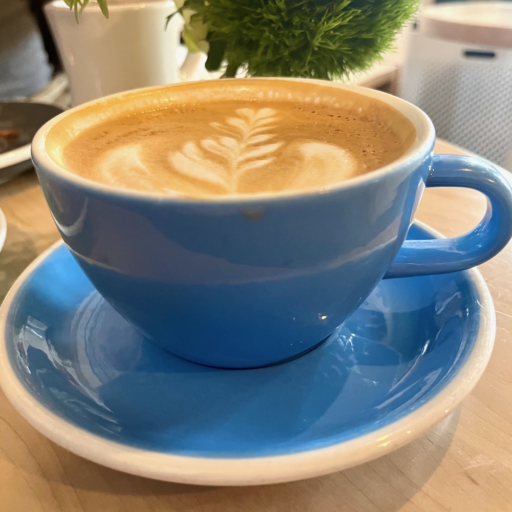 ugly duck coffee is a friendly breakfast spot in rochester, ny that serves its lattes and other hot drinks in home blue china cups. 