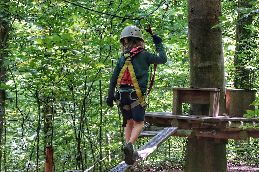 If your outdoor vacation takes you to a woodsy adventure park be sure to protect kids against mosquitos, ticks and hay fever.