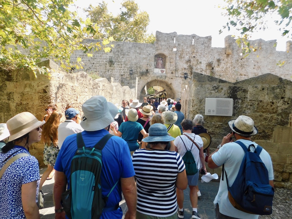 The wall medieval city in rhodes is popular with tourists and cruise-ship visitors. They can bottle neck at the busy town gates.