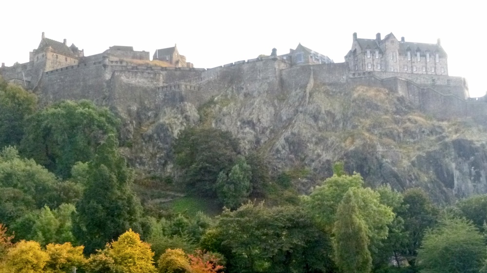 Hulking edinburgh castle towers over the city, a bit reminiscent of hogwarts.