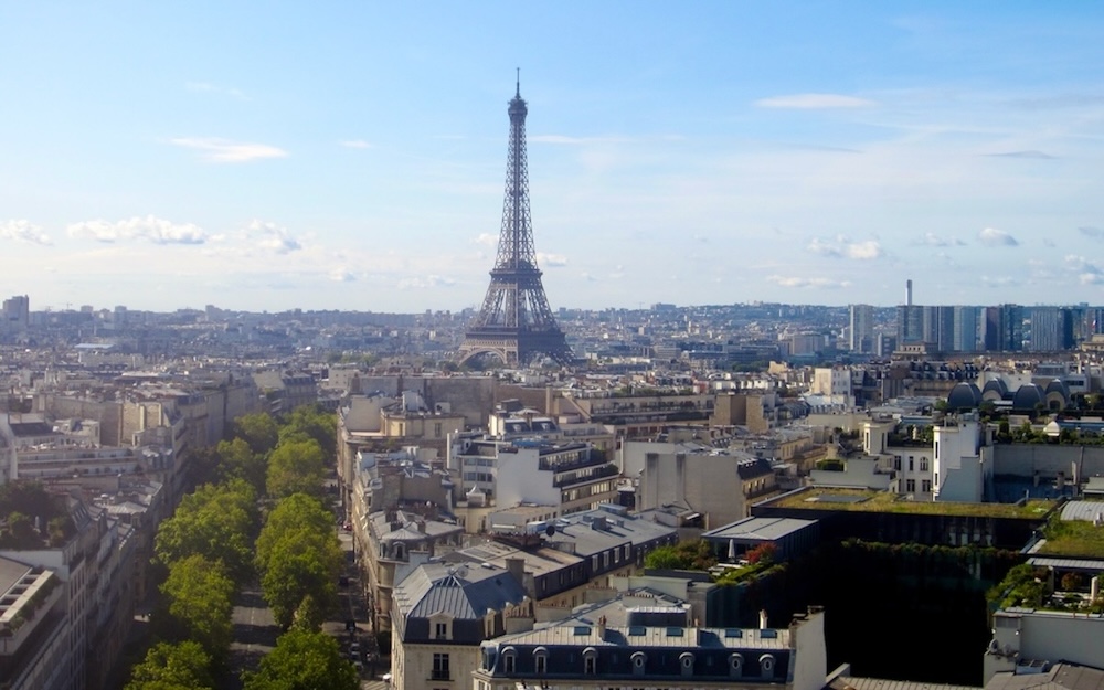 Claimbing to the top of the arc de triomphe with kids for a stellar view of paris, including the eiffel tower.