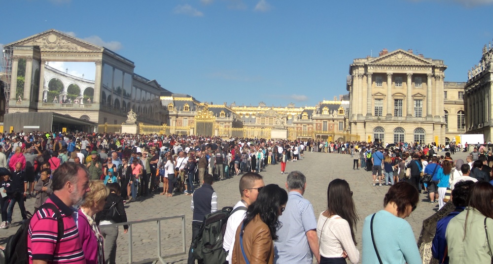 Large crowds line up to visit versailles every day. It's a good idea to book a tour with kids, partly to skip the line.